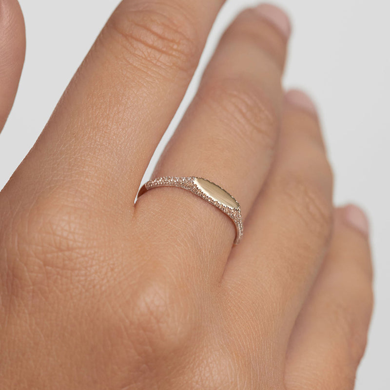 Person wearing Noura ring with close up shot of hand with ring