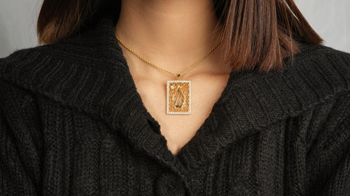 Person wearing Allah Necklace